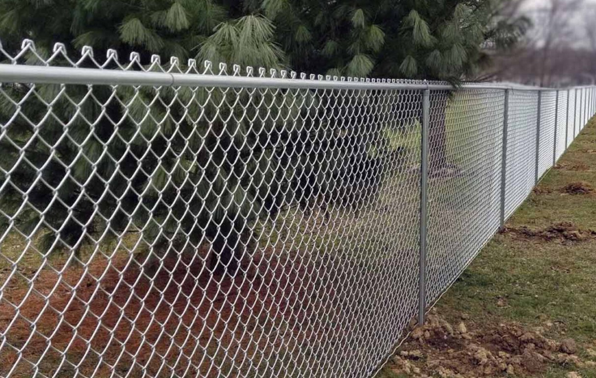 New chain-link fence installation in Lancaster, TX yard